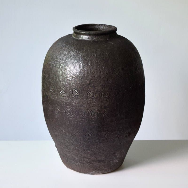 Rustic Distressed Rounded Vase With Circular Engraved Pattern With Black Shiny Texture - -