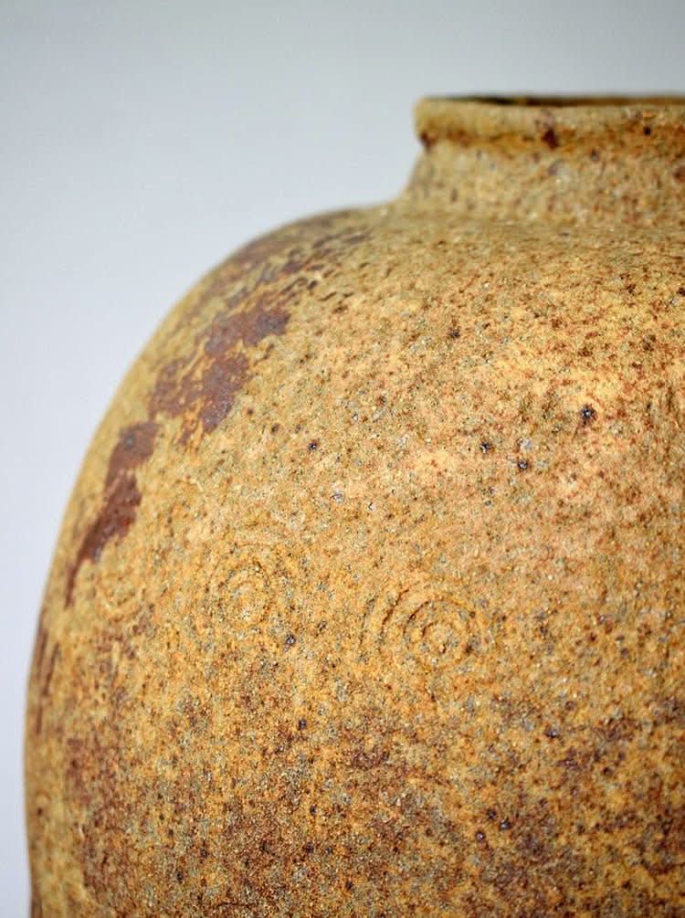 Rustic distressed vase with circular engraving, dark green blue glaze, home decor.