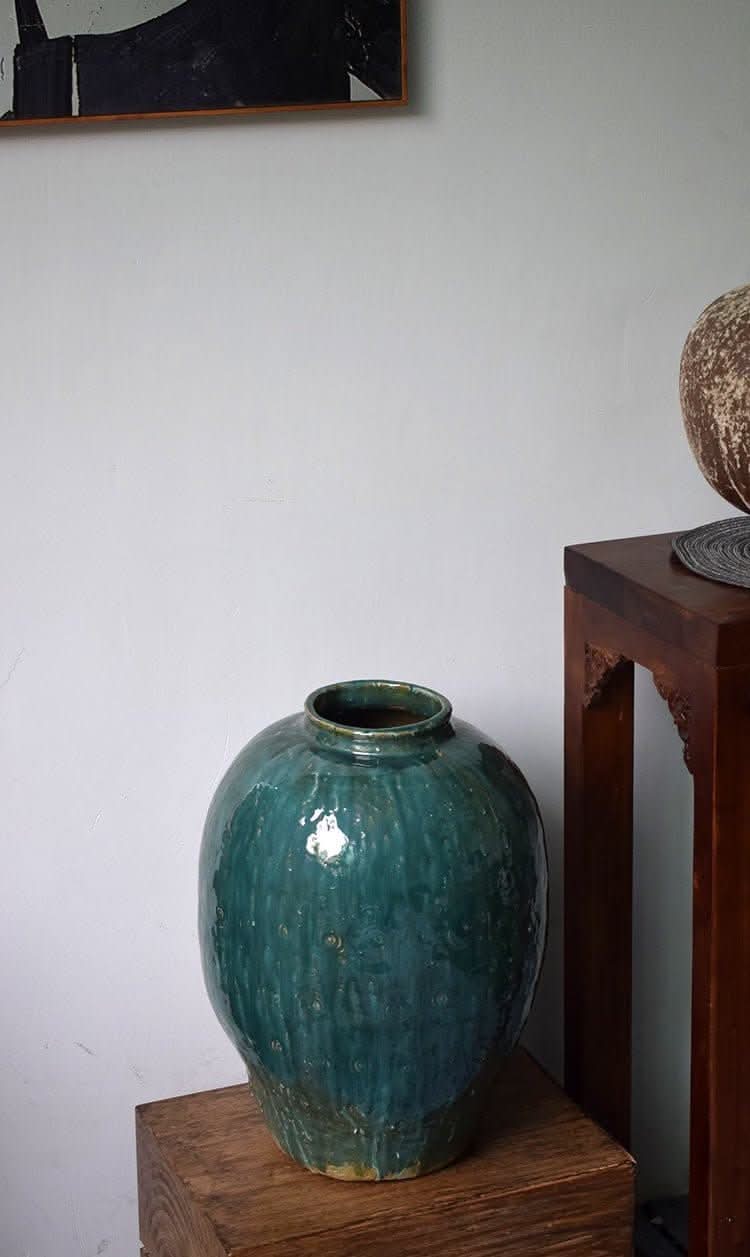 Rustic Distressed Rounded Vase, dark green-blue glaze, circular engraved pattern.