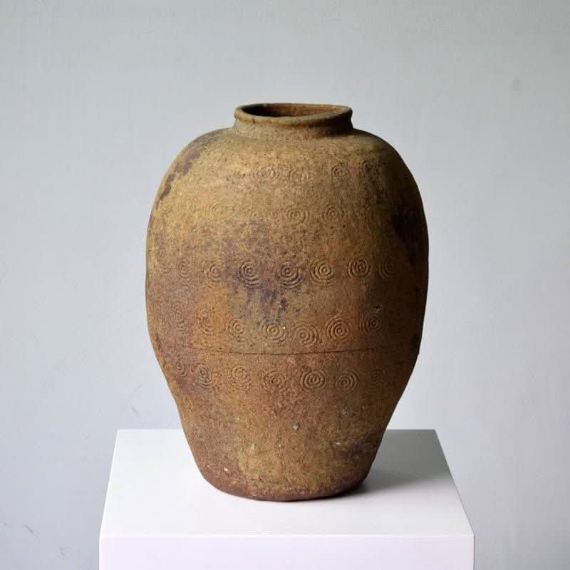 Rustic Distressed Rounded Vase, driftwood color, circular engraved pattern.