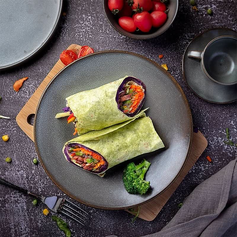 Rustic Plates Ceramic Breakfast Set: two veggie wraps with colorful filling on dark grey ceramic plate