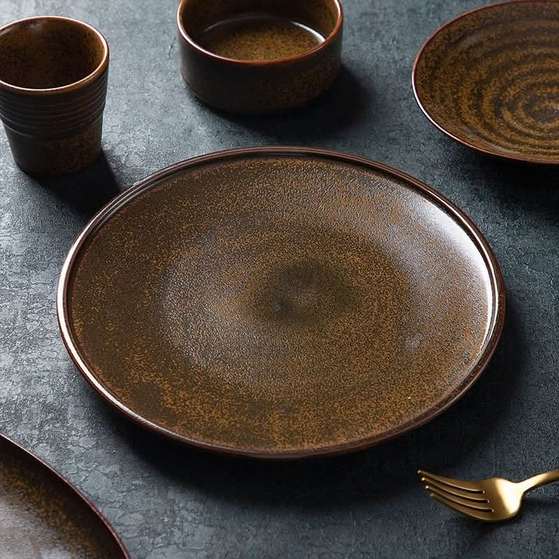 Rustic Plates Ceramic Breakfast Set: brown speckled ceramic dishes with golden fork on dark textured surface.