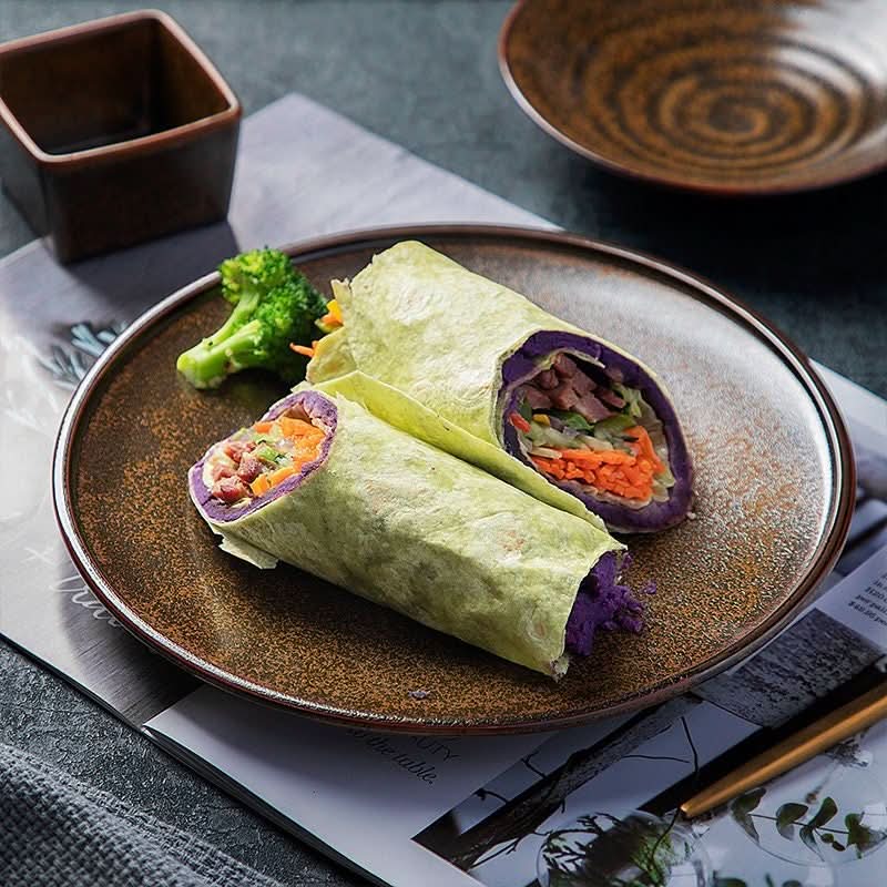 Rustic plates ceramic breakfast set with wraps & broccoli.