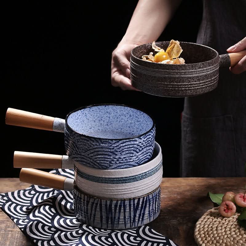 Rustic stoneware baking plates with Japanese art, blue wave pattern & wooden handle.
