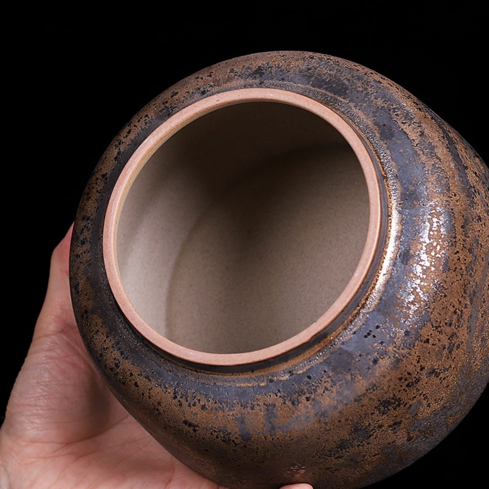 Rustic Traditional Chinese Ceramic Tea Can: speckled brown and black glaze, rustic texture.