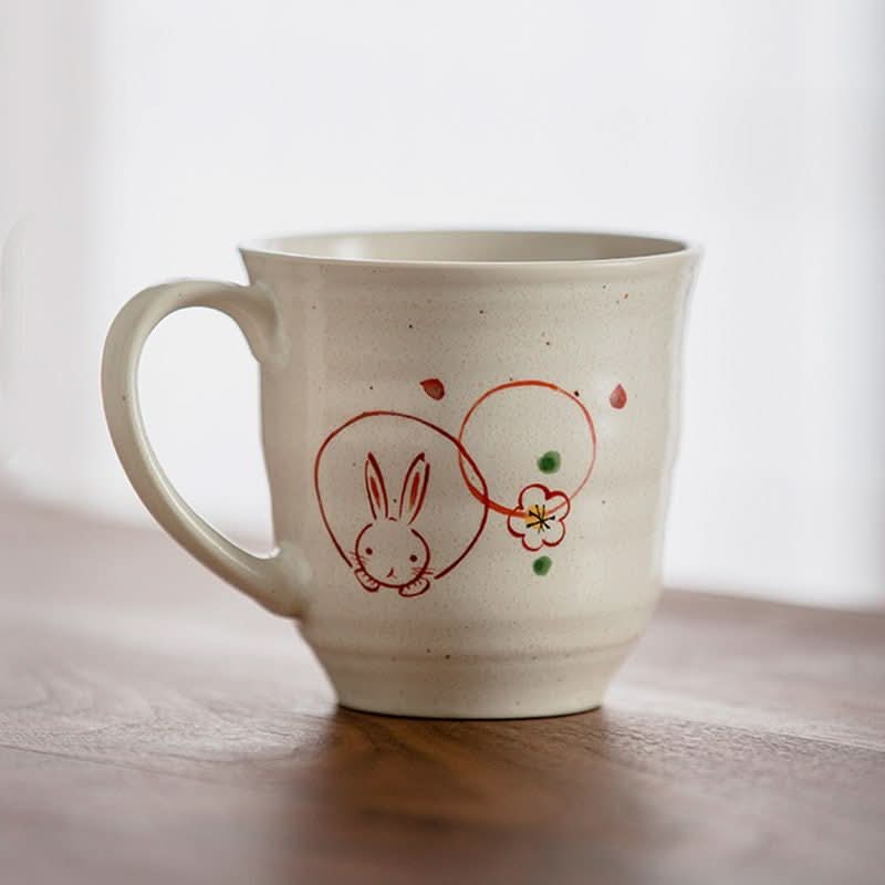 Hand-painted Sakura Rabbit Couple Mug set. Ceramic mug with a cute bunny illustration.