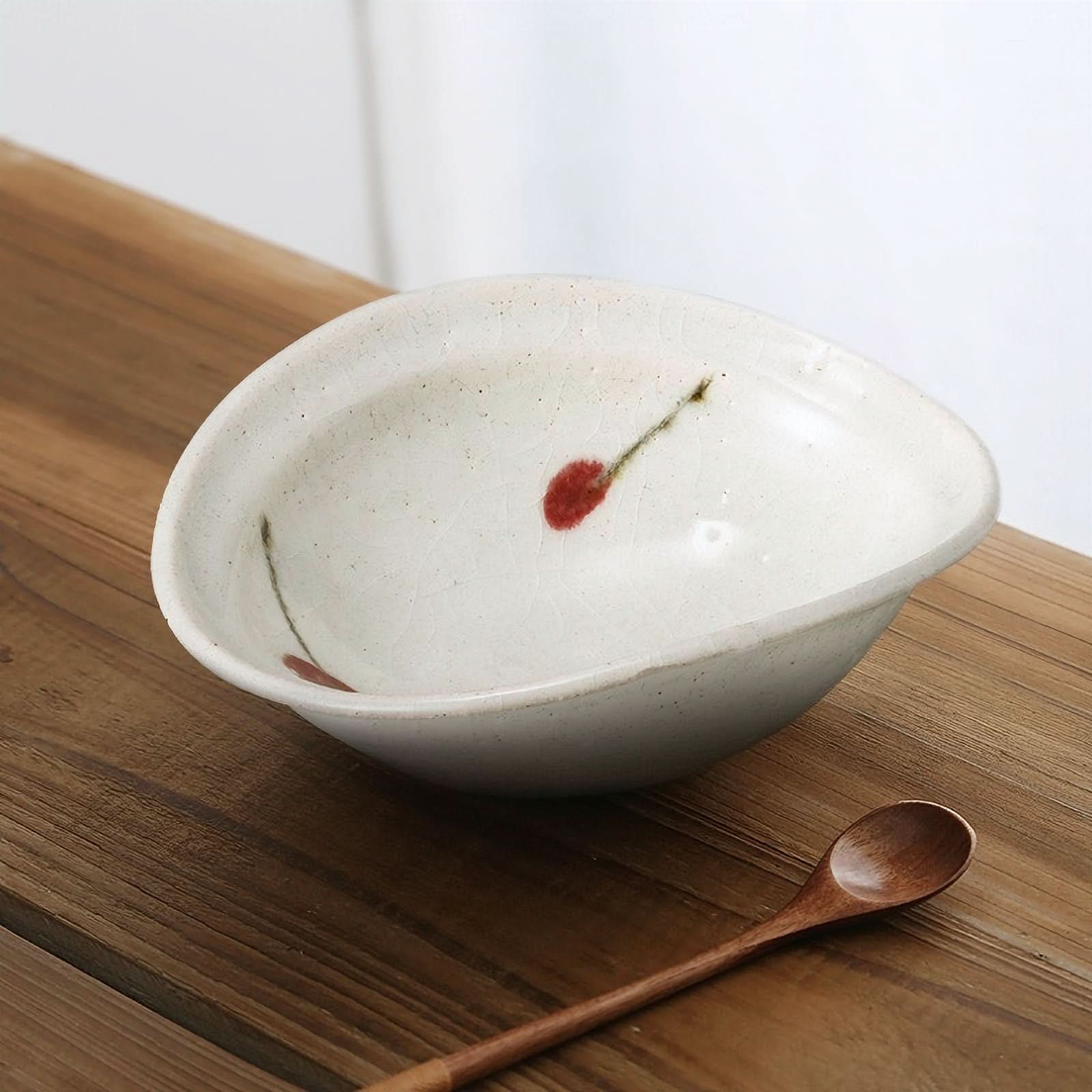 Hand-made Ice Cracked Cherry Glaze Tableware bowl with red cherry design on rustic wood table.