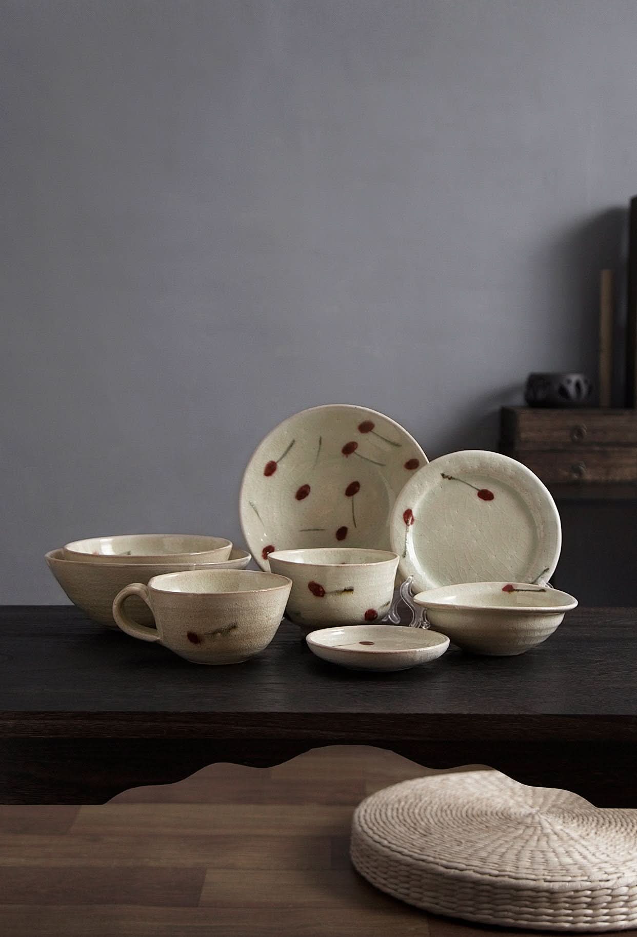 Set of Ice Cracked Cherry Glaze Tableware: rustic, handmade Japanese dinnerware with red cherry design.