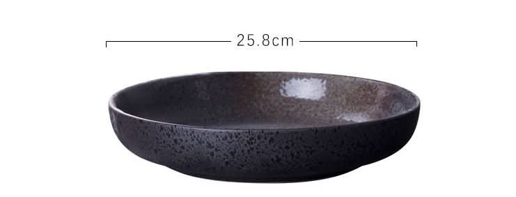 Shallow ceramic salad bowl with speckled gradient finish, part of Home Decor collection.