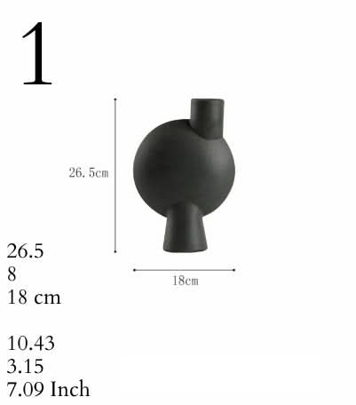 Small Ceramic Vase in black, a modern home decor accent piece.