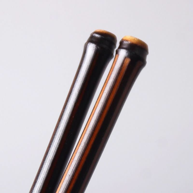 Solid Bamboo Chopsticks with Glossy Finish, dark brown with natural wood tops.