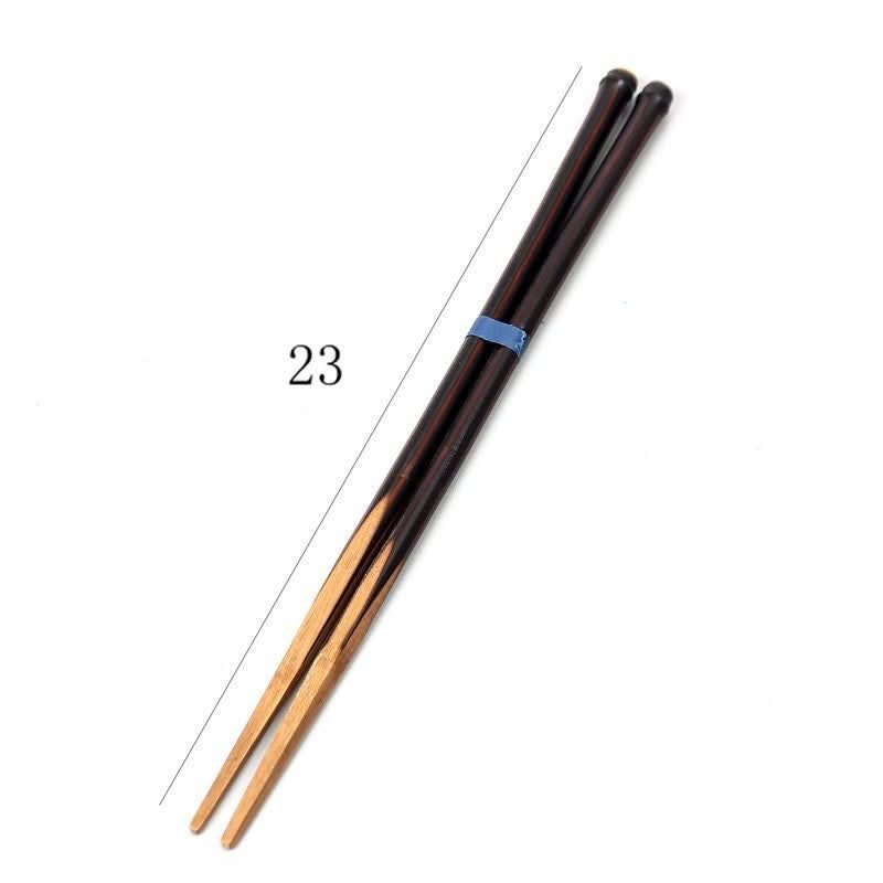 Solid Bamboo Chopsticks With Glossy Finish, two dark brown and natural bamboo chopsticks tied with blue band.