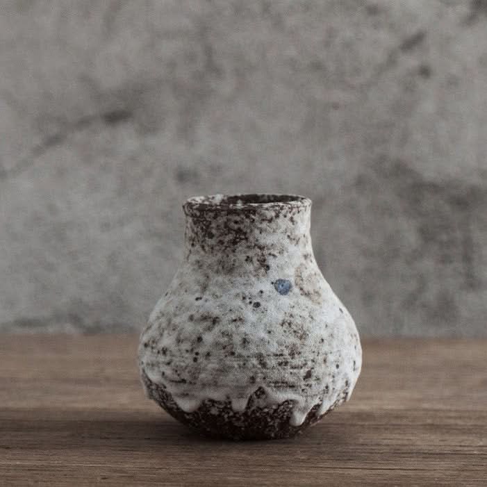 Speckled Gray Small Ceramic Vase with rustic stoneware texture on wood table