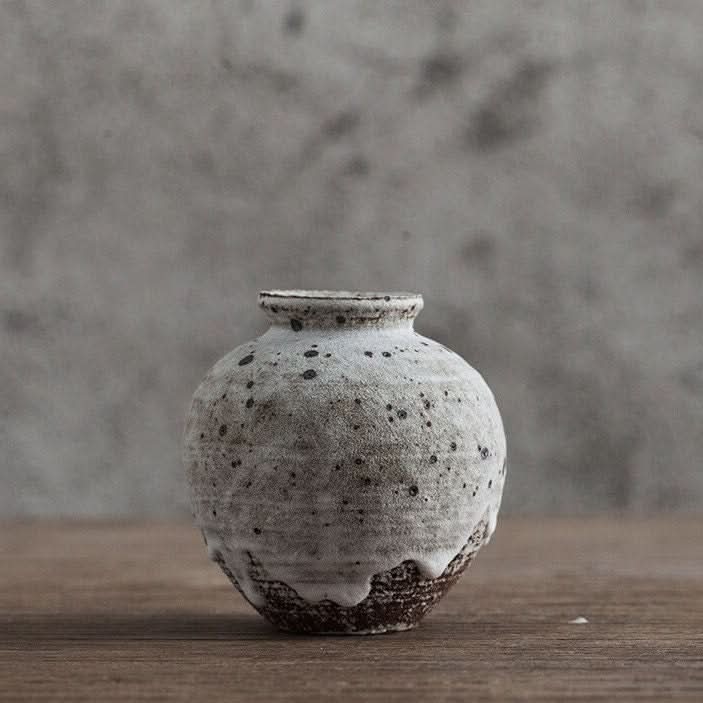 Speckled Gray Small Ceramic Vase with rustic stoneware finish on wooden table.