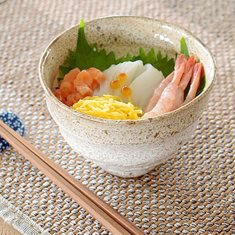 Rustic ceramic ramen bowls 14.54oz filled with seafood and toppings, served with chopsticks.
