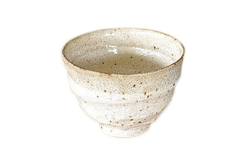 Cream speckled ceramic ramen bowl with rustic texture.