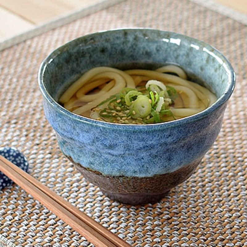 Blue and brown ceramic ramen bowls 14.54oz with udon noodles, scallions, and sesame seeds