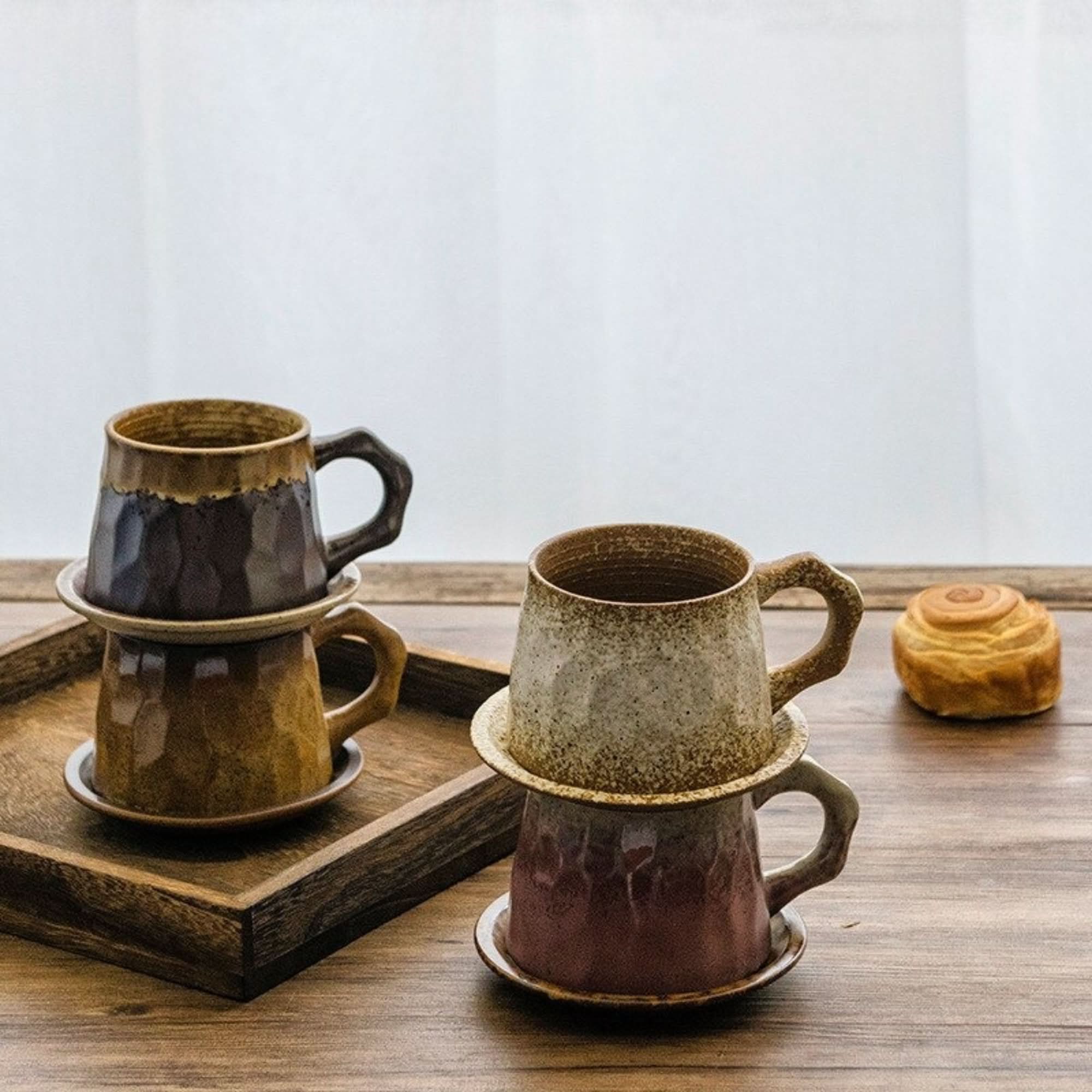 Earthy, speckled Stoneware Mug 10.14oz +Free Saucer stacked with a pastry, on wooden table.