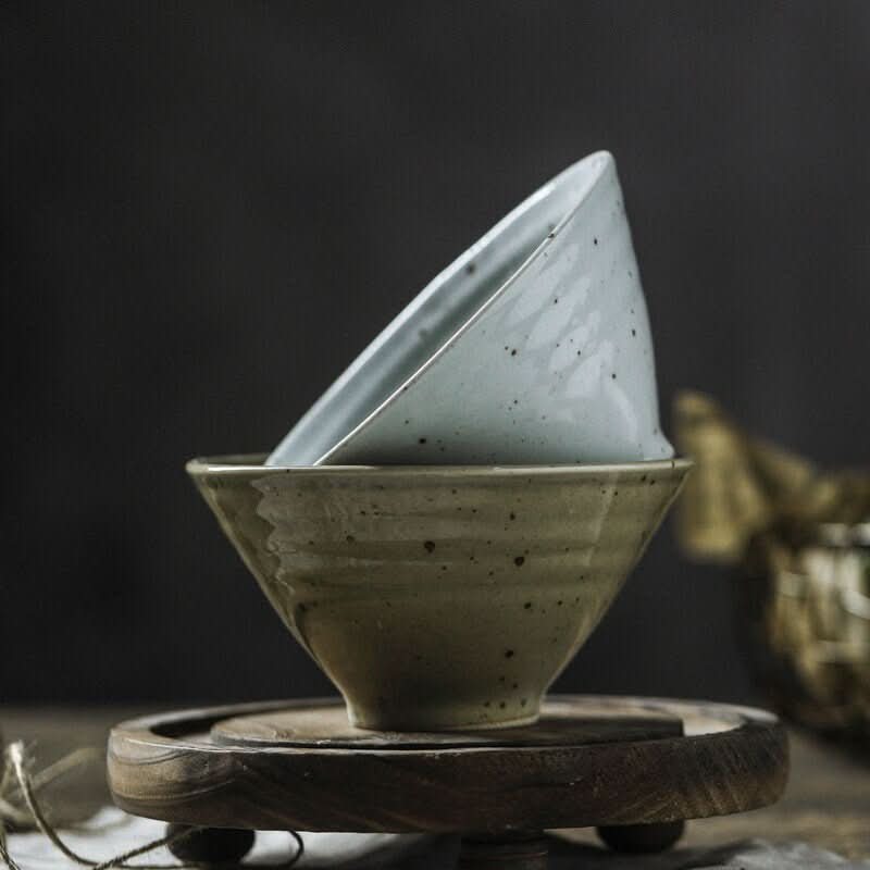 Stoneware Bow with Ring Texture, stacked light blue speckled bowl atop olive green textured bowl.