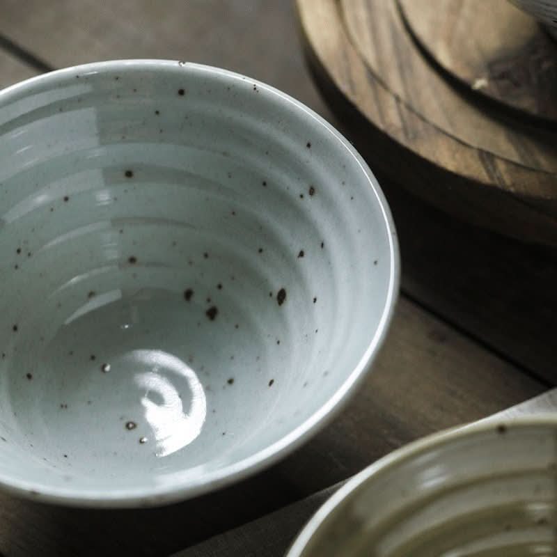 Light blue speckled stoneware bowl with ring texture, ideal for cereals, rice, pasta, fruit, or Asian soup.