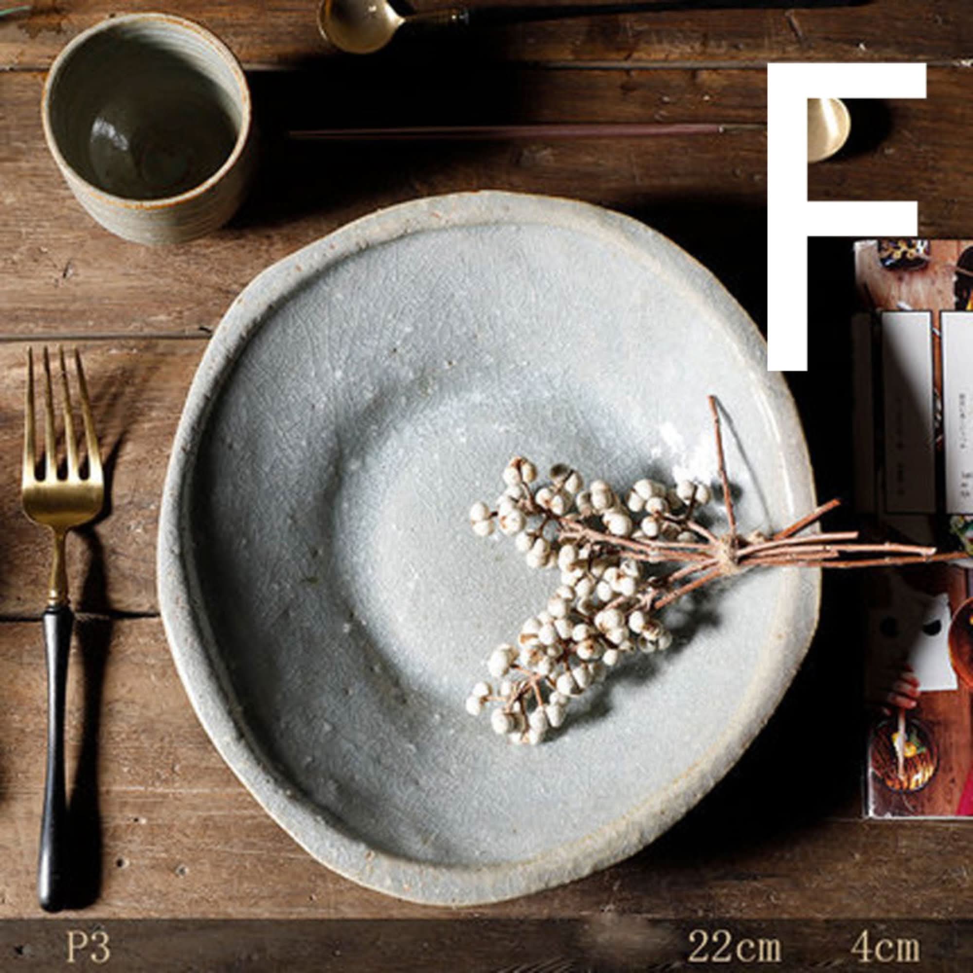 Stoneware Handmade Irregular Ice Cracked Ceramic Tableware, light gray, with dried berries on wooden table.