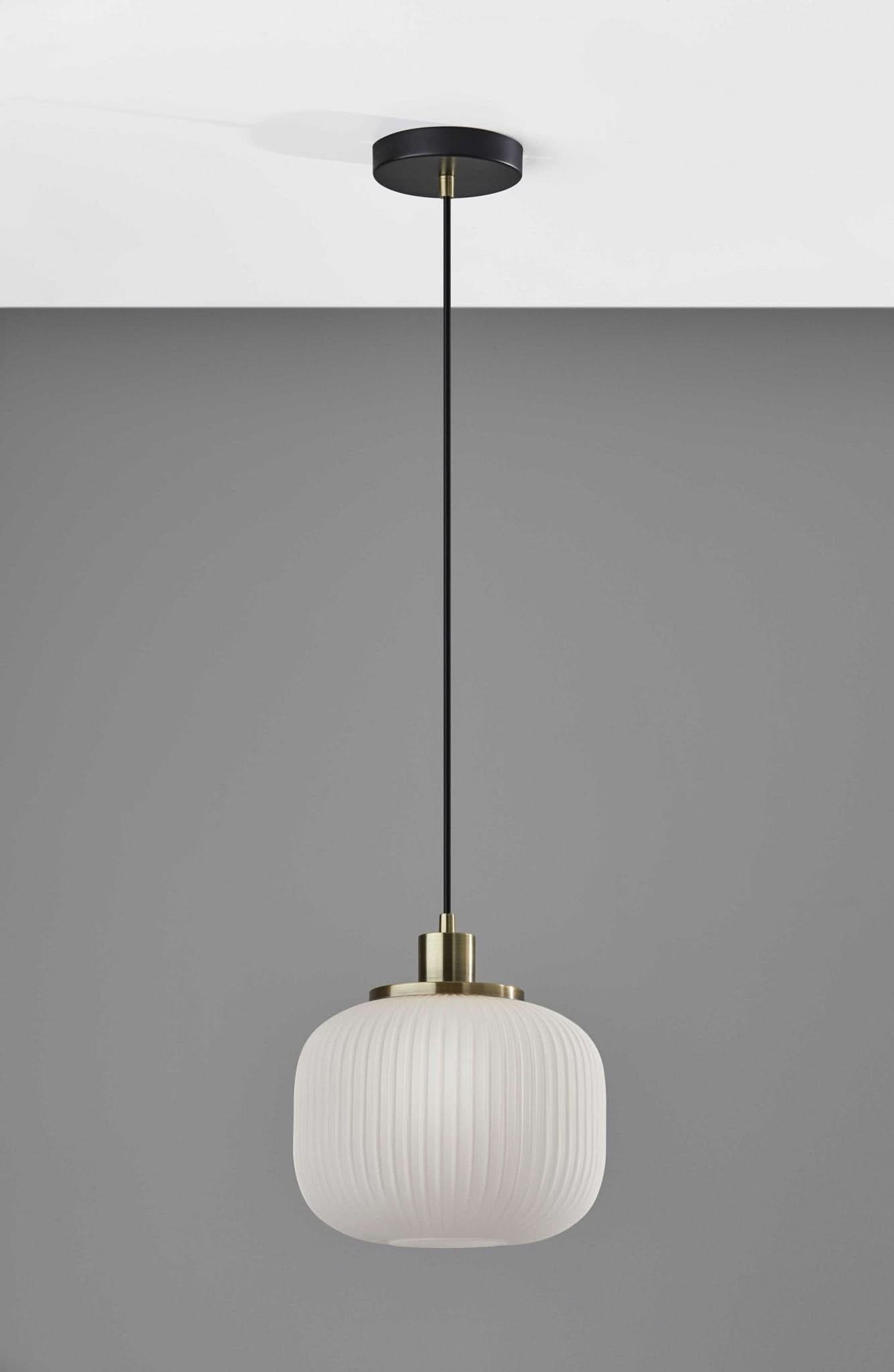 Striped Glass Glow Metal Pendant: frosted ribbed glass lantern with brass accents, modern luxury decor.