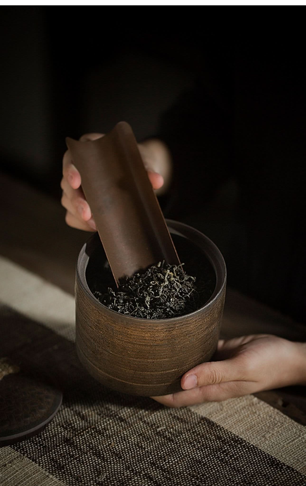 Japanese style ceramic storage jar for tea ceremony, coffee, sugar. Textured brown finish.