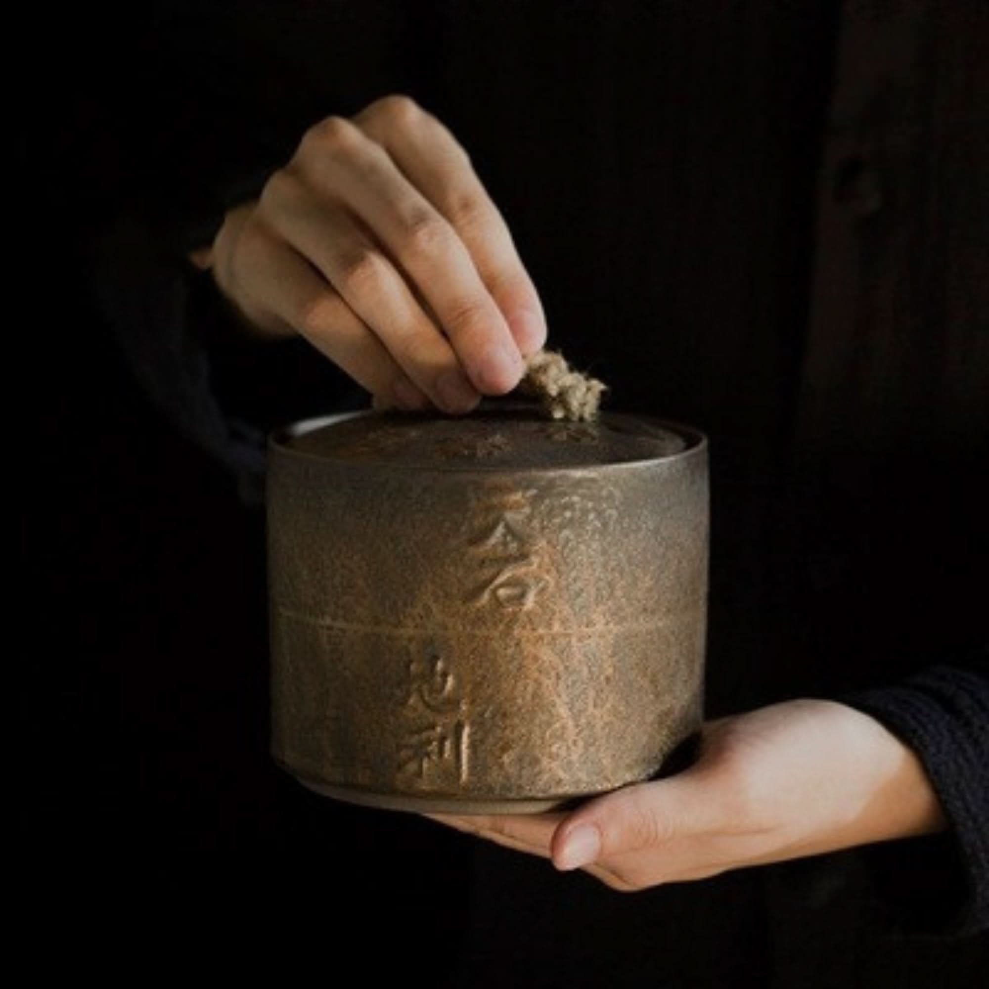 Japanese style ceramic jar with calligraphy, ideal for tea, coffee, or sugar storage.