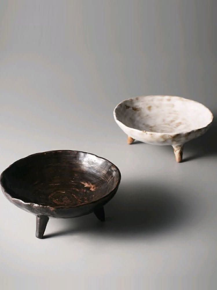 Tripod Stoneware Ceramic Irregular Fruit Bowl in dark and white rustic finishes.