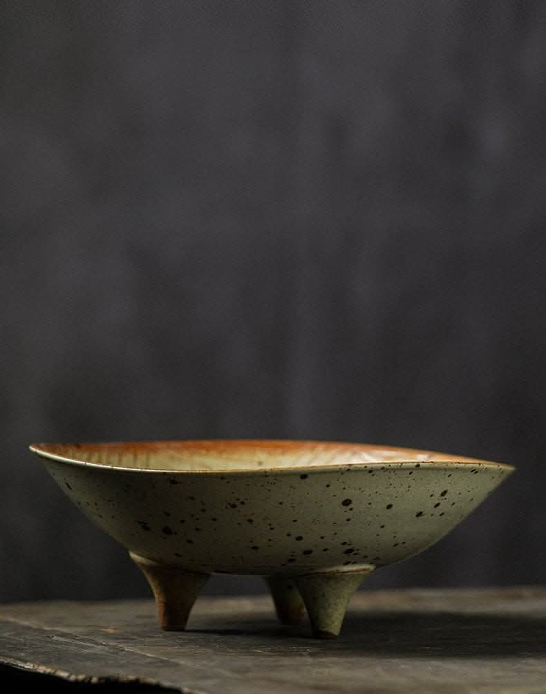 Tripod Stoneware Fruit Plate with speckled finish and warm rim