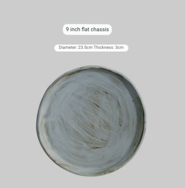 Stoneware plates with white glaze, rustic textured finish, 9-inch diameter.
