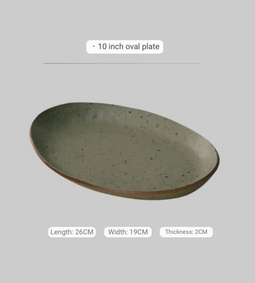 Handmade unglazed earthenware dinner plate in speckled light grey, oval shape.