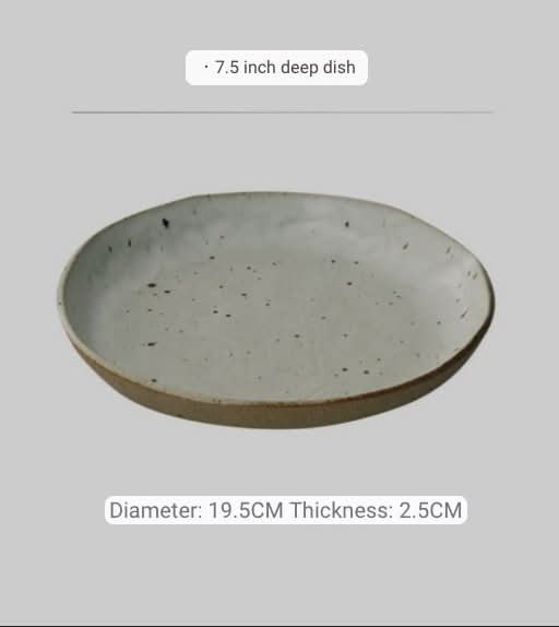 Handmade unglazed earthenware dinner plate with speckled finish and natural clay rim.
