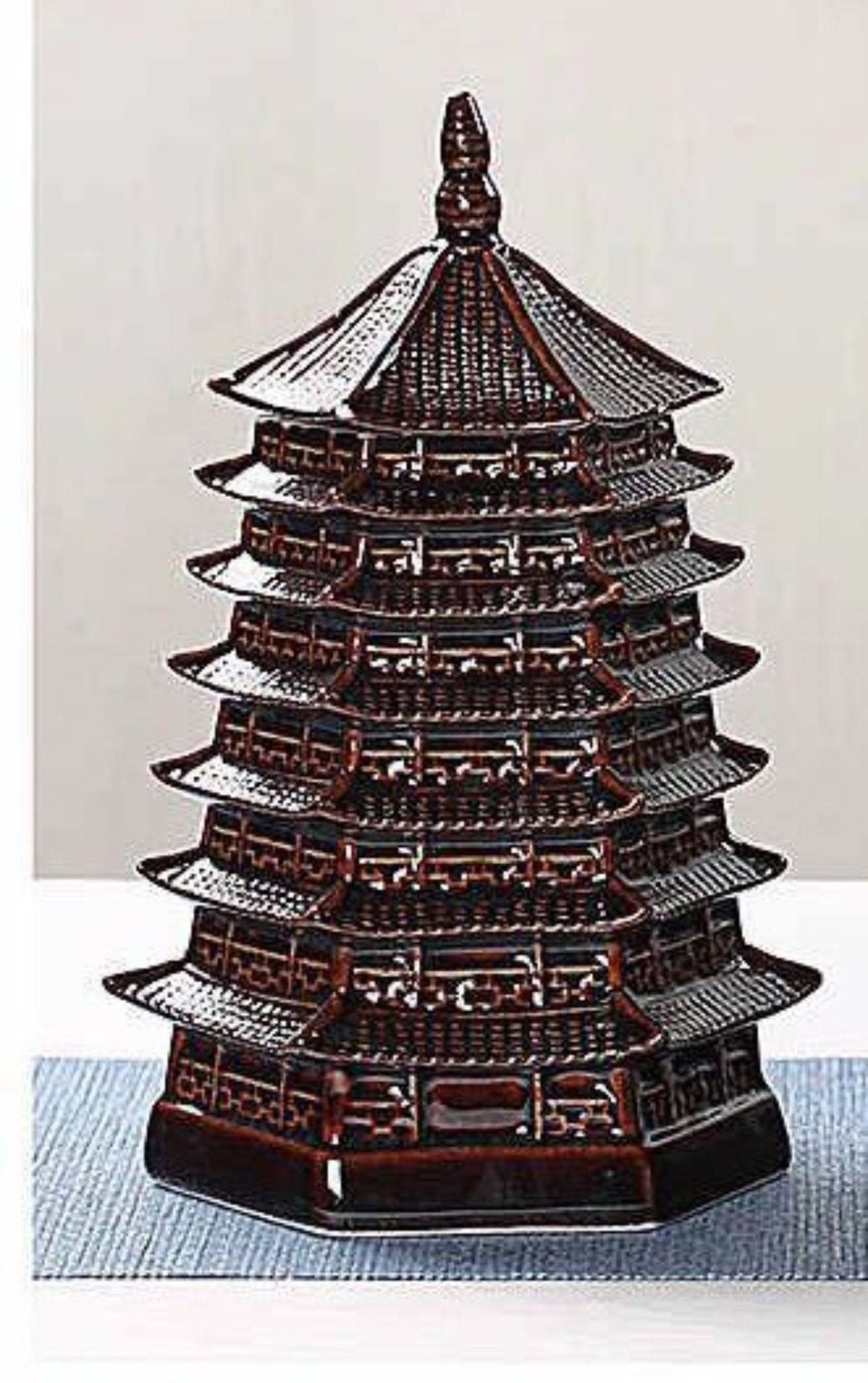 Vintage Japanese pagoda kitchen canister, dark brown ceramic, perfect for tea, coffee, or spices.