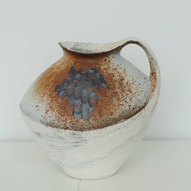 Wabi-sabi clay pot with brushstroke effect, rust, and grey accents. Home decor.