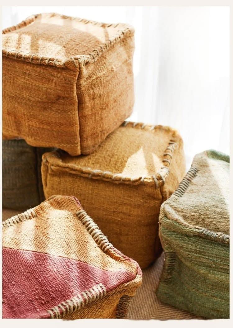 Wabi-sabi jute ottoman footstools in earthy tones with textured stitching, handmade home decor.