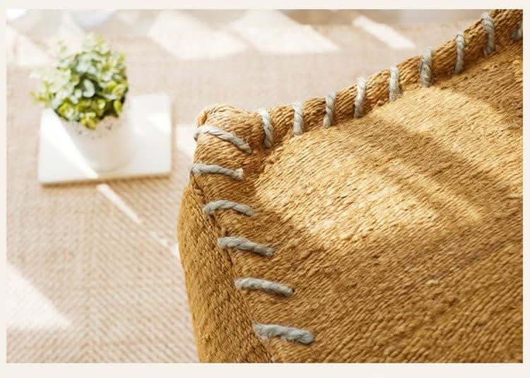 Wabi-sabi Jute Ottoman Footstool: Textured natural fiber, grey stitching, with potted plant decor.