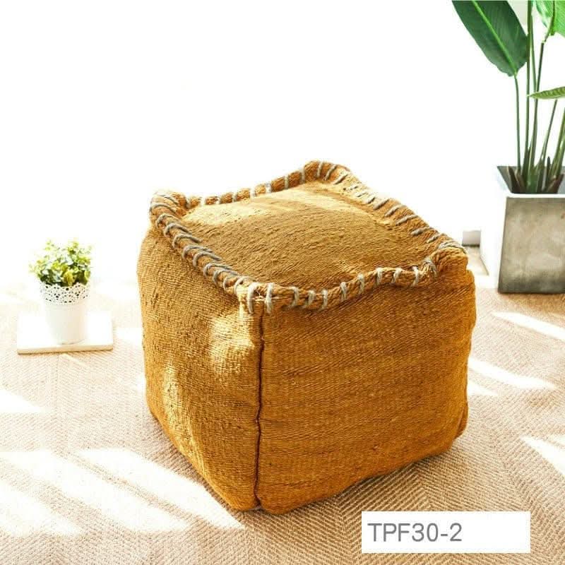 Wabi-sabi jute ottoman footstool in mustard yellow, handmade with decorative stitching.