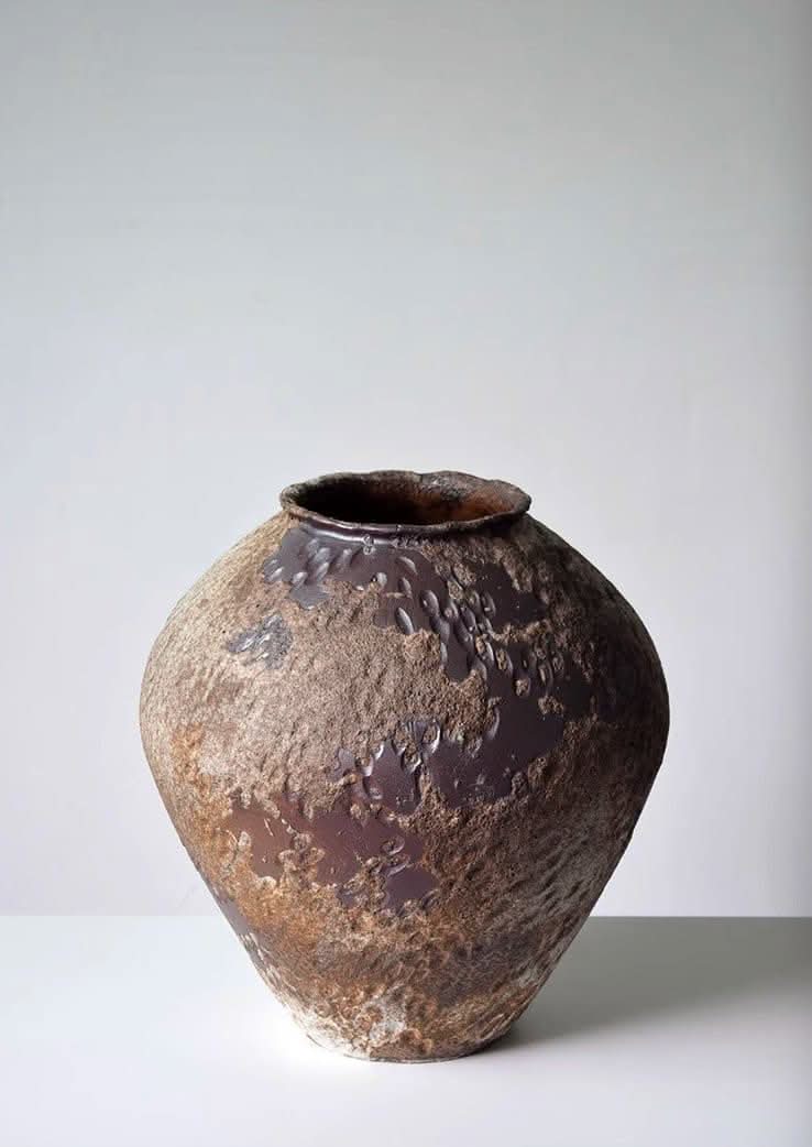 Wabi-Sabi rounded ceramic vase, 35x35cm, with hammered distressed texture and a dark glaze.