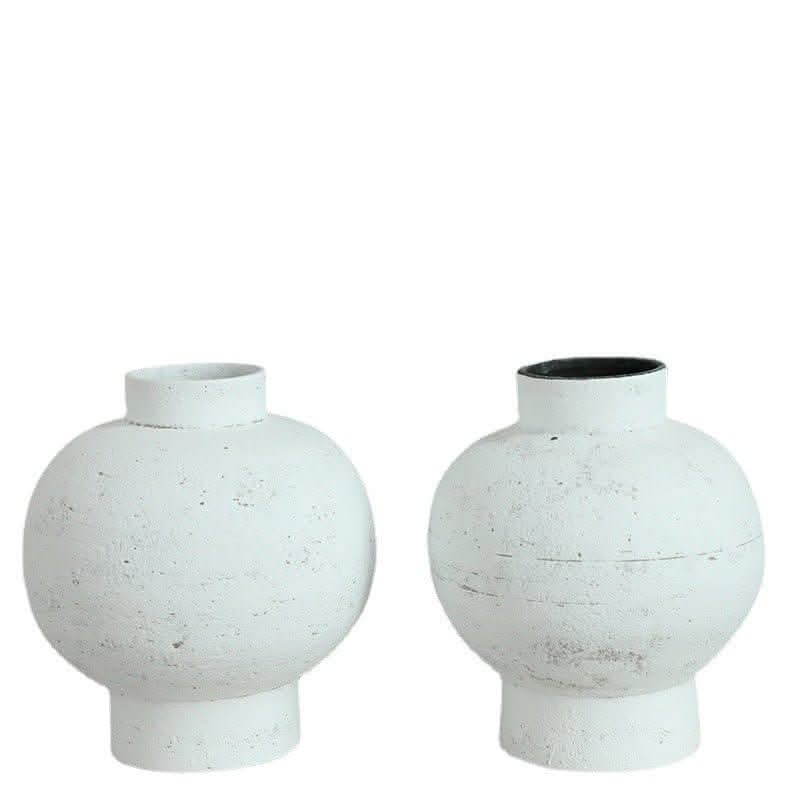 Two Wabi-sabi white clay pots with tight openings and a rustic finish, perfect for home decor.