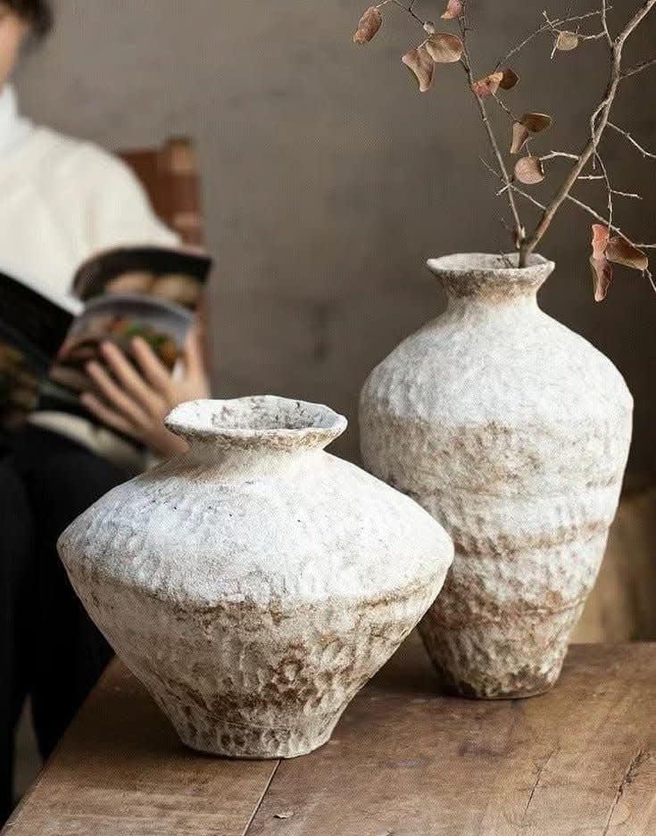 Wabi-Sabi White Distressed Rustic Vases: textured, off-white ceramic home decor on a wooden surface.