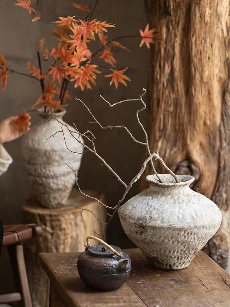 Two Wabi-Sabi White Distressed Rustic Vases on wooden table with fall leaves & rustic decor.