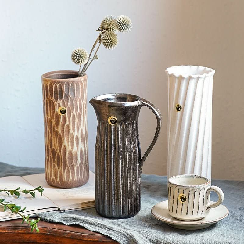 Water Cylindrical Black Glaze Carved Pattern Vase with white and brown vases
