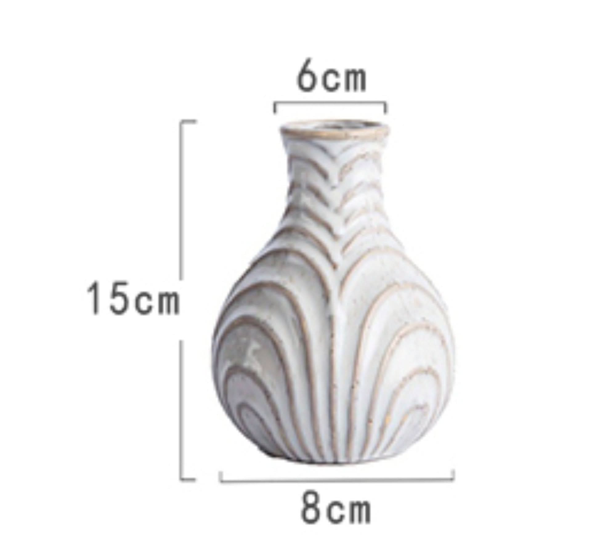 White ceramic small vase with textured, naturalistic finish. Home decor.