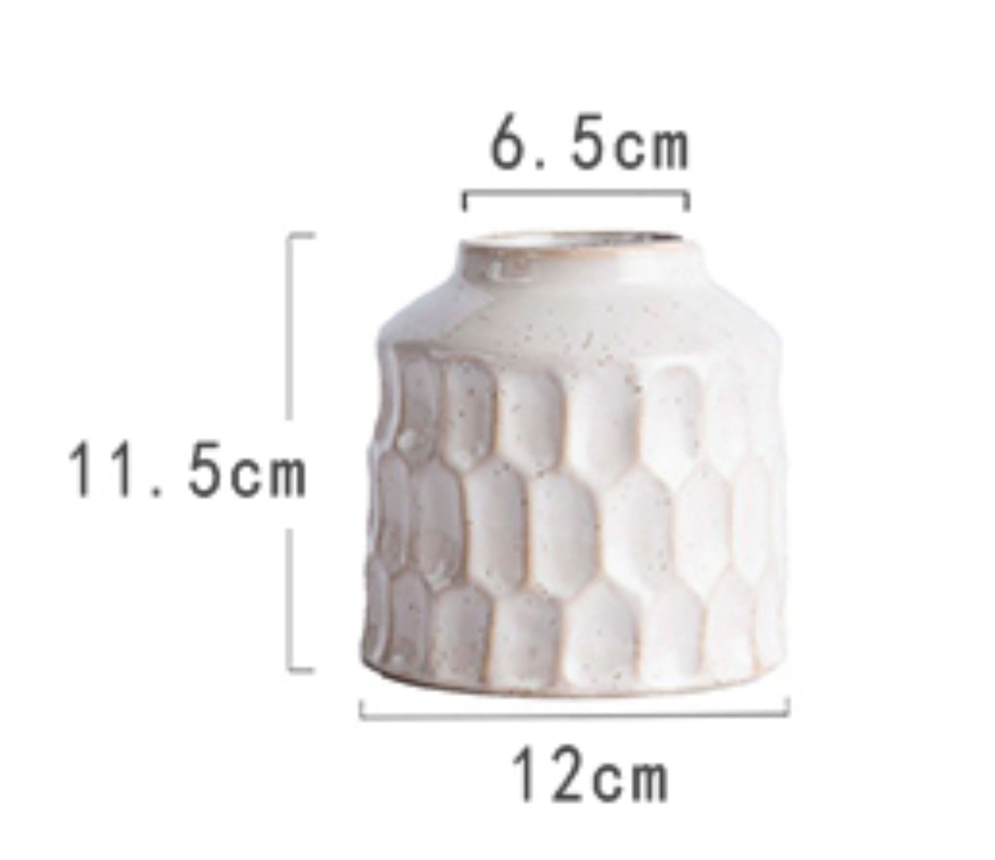 White ceramic small vase with honeycomb texture, 11.5cm tall, 12cm wide.