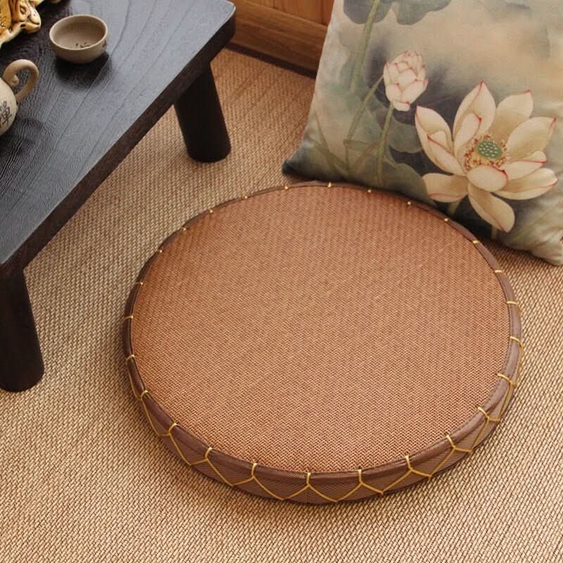 Round Zabuton Meditation Chair with Japanese Tatami straw cushion on textured rug.
